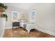 Bright bedroom featuring two windows, hardwood floors and decorative plants at 2318 S Lincoln St, Denver, CO 80210