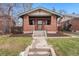 Charming brick bungalow with well-maintained front yard and inviting entrance at 2318 S Lincoln St, Denver, CO 80210