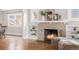 Close up on the fireplace and mantel with decor and shelving at 2318 S Lincoln St, Denver, CO 80210