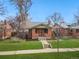 Charming brick home with a well-manicured lawn and inviting entrance at 2318 S Lincoln St, Denver, CO 80210