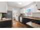 Efficient kitchen featuring stainless steel appliances and granite countertops at 2318 S Lincoln St, Denver, CO 80210