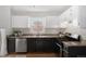 Modern kitchen with stainless steel appliances and granite countertops at 2318 S Lincoln St, Denver, CO 80210