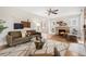 Inviting living room featuring a cozy fireplace, hardwood floors, and stylish decor at 2318 S Lincoln St, Denver, CO 80210