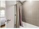 Modern bathroom featuring a bathtub with stylish gray tiling and a shower fixture at 3931 Utica St, Denver, CO 80212