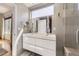 Bright bathroom with a double sink vanity, large mirror, and modern fixtures at 3931 Utica St, Denver, CO 80212
