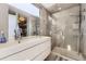 Modern bathroom with a double sink vanity, and a glass-enclosed shower at 3931 Utica St, Denver, CO 80212