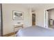 Comfortable bedroom featuring wood floors, and ample natural light from a large window at 3931 Utica St, Denver, CO 80212