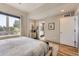 Bright bedroom with a comfortable bed, wood floors, and ample natural light at 3931 Utica St, Denver, CO 80212
