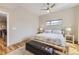 Serene bedroom with a log-style bed, wood floors, and a contemporary ceiling fan for added comfort at 3931 Utica St, Denver, CO 80212