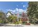 Modern two-story home showcasing unique architecture and beautiful landscaping on a sunny day at 3931 Utica St, Denver, CO 80212