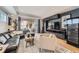 Inviting living room with hardwood floors, plush seating, and sliding doors opening to an outdoor space at 3931 Utica St, Denver, CO 80212