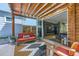 Covered patio features an outdoor seating area with a view into the home's living area at 3931 Utica St, Denver, CO 80212