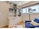 Bright reading nook features a built-in bookcase, a cozy chair, and natural light at 3931 Utica St, Denver, CO 80212