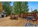 A well-designed outdoor deck, perfect for entertaining, features patio furniture and a peaceful atmosphere at 5573 S Datura St, Littleton, CO 80120