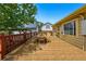 An inviting back deck is spacious and features an outdoor dining set at 5573 S Datura St, Littleton, CO 80120