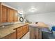 Cozy bar with custom wood countertops and cabinets, perfect for entertaining at 5573 S Datura St, Littleton, CO 80120