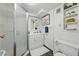 Bathroom with a white shower, vanity, and neutral-tone walls at 5573 S Datura St, Littleton, CO 80120