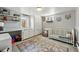 Comfortable Bedroom with a crib, changing table, and lots of storage space at 5573 S Datura St, Littleton, CO 80120