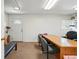 Spacious office area featuring ample desk space and natural light, perfect for a work environment at 5573 S Datura St, Littleton, CO 80120