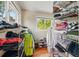 Spacious walk-in closet with custom shelving and ample storage, and natural light at 5573 S Datura St, Littleton, CO 80120