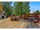 Charming wooden deck with outdoor dining set, perfect for entertaining guests and relaxing outside at 5573 S Datura St, Littleton, CO 80120