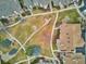 Aerial view of community green space with manicured walking paths and trees at 2132 S Scranton Way, Aurora, CO 80014