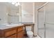 Bathroom featuring a glass shower and vanity with sink at 2132 S Scranton Way, Aurora, CO 80014