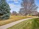 A sidewalk between greenbelts of the neighborhood at 2132 S Scranton Way, Aurora, CO 80014