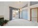 The dining area features a sliding glass door leading to the patio and a vintage chandelier at 2132 S Scranton Way, Aurora, CO 80014