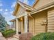 Home's front entrance with steps leading to a covered porch at 2132 S Scranton Way, Aurora, CO 80014