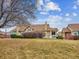 Charming exterior view of well-maintained building with green lawn and mature landscaping in neighborhood at 2132 S Scranton Way, Aurora, CO 80014