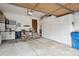 Well-organized garage with ample storage cabinets and an overhead door at 2132 S Scranton Way, Aurora, CO 80014