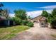 Quaint backyard featuring a shed, green lawn, and privacy trees, perfect for outdoor enjoyment and storage at 5549 S Greenwood St, Littleton, CO 80120