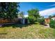 Fenced backyard featuring a storage shed and a well-manicured lawn at 5549 S Greenwood St, Littleton, CO 80120