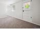 Well-lit bedroom with neutral carpet and fresh paint, creating a serene and inviting space at 5549 S Greenwood St, Littleton, CO 80120