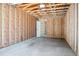 Unfinished garage interior featuring a door for easy access from the outside at 5549 S Greenwood St, Littleton, CO 80120