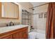 Cozy bathroom with warm colored tile in the shower at 12531 W Alameda Dr, Lakewood, CO 80228