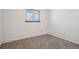 Bright bedroom featuring neutral carpet, a window for natural light at 12531 W Alameda Dr, Lakewood, CO 80228