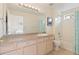 Bright bathroom featuring a bath and shower combination with a large mirror over the sink and vanity at 18661 E Water Dr # F, Aurora, CO 80013