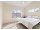 Cozy bedroom with plush carpet, ample natural light, and comfortable queen bed at 18661 E Water Dr # F, Aurora, CO 80013