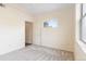 Cozy bedroom with neutral carpet, light-colored walls, and bright natural light at 18661 E Water Dr # F, Aurora, CO 80013
