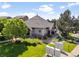 Community clubhouse with stone accents, well-manicured lawn, and mailbox cluster at 18661 E Water Dr # F, Aurora, CO 80013