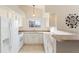 Well-lit kitchen featuring white appliances, ample counter space, and neutral tones at 18661 E Water Dr # F, Aurora, CO 80013