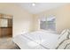 Bright main bedroom features a vaulted ceiling, large window, and adjoins main bathroom at 18661 E Water Dr # F, Aurora, CO 80013