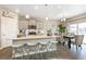 Modern kitchen with gray cabinets, quartz countertops, and stainless steel appliances at 9902 Cathay St, Commerce City, CO 80022