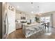 Modern kitchen with gray cabinets, quartz countertops, and stainless steel appliances at 9902 Cathay St, Commerce City, CO 80022