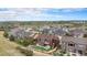Stunning aerial view of a home with a well-manicured yard in a beautiful neighborhood at 3745 Spanish Oaks Trl, Castle Rock, CO 80108
