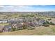 Expansive aerial view showcasing the community and the surrounding scenic landscape at 3745 Spanish Oaks Trl, Castle Rock, CO 80108