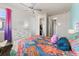 Colorful bedroom with a ceiling fan and bright decor creates a vibrant and inviting space at 3745 Spanish Oaks Trl, Castle Rock, CO 80108