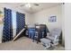 Charming bedroom with a creative bunk bed, slide, and a cozy reading nook at 3745 Spanish Oaks Trl, Castle Rock, CO 80108
